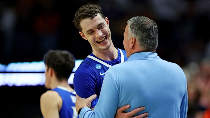 Mar 22, 2025; Lexington, KY, USA;  Creighton Bluejays center Ryan Kalkbrenner (11) reacts with head coach Greg McDermott during the second half against the Auburn Tigers in the second round to the NCAA Tournament at Rupp Arena.