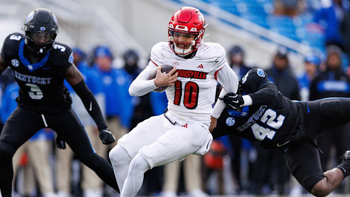 Nov 30, 2024; Lexington, Kentucky, USA; Louisville Cardinals quarterback Pierce Clarkson (10) runs the ball during the fourth quarter against the Kentucky Wildcats at Kroger Field. Mandatory Credit: Jordan Prather-Imagn Images