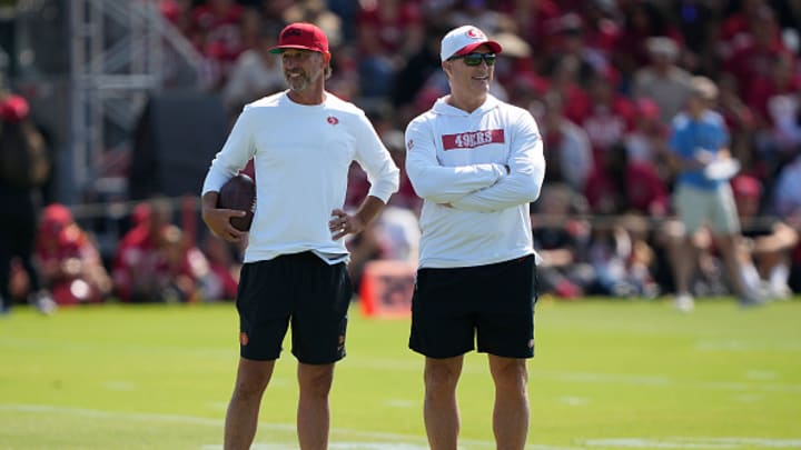 Head coach Kyle Shanahan and General manager John Lynch of the San Francisco 49ers look on during training camp at SAP Performance Facility on July 29, 2024 in Santa Clara, California.