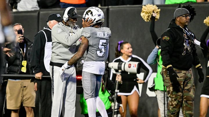 Colorado Buffaloes coach Deion Sanders has a conversation with wide receiver Jimmy Horn Jr. after a negated touchdown resulting from a taunting penalty against Horn Jr. in the first quarter against the Cincinnati Bearcats at Folsom Field on October 26, 2024. 
