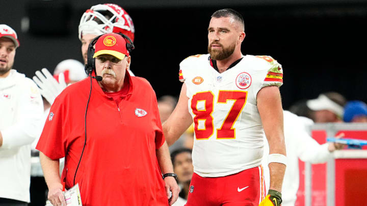Head coach Andy Reid and Travis Kelce #87 of the Kansas City Chiefs look on during the second quarter of a game against the Las Vegas Raiders at Allegiant Stadium on November 26, 2023 in Las Vegas, Nevada.