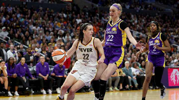 Caitlin Clark #22 of the Indiana Fever drives to the basket against Cameron Brink #22 of the Los Angeles Sparks during the fourth quarter at Crypto.com Arena on May 24, 2024 in Los Angeles, California. Caitlin Clark #22 of the Indiana Fever drives to the basket against Cameron Brink #22 of the Los Angeles Sparks during the fourth quarter at Crypto.com Arena on May 24, 2024 in Los Angeles, California.