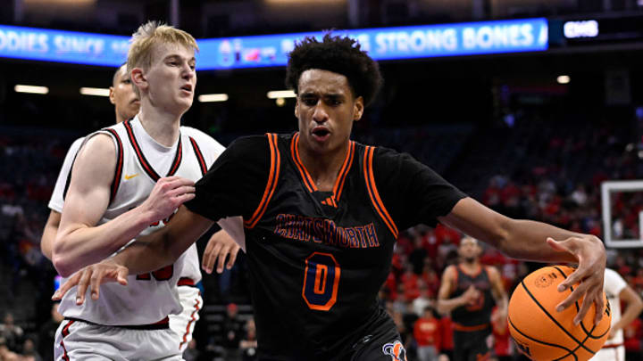 Alijah Arenas drives to the hoop during a state championship.