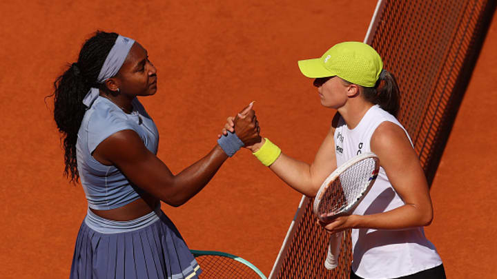 Coco Gauff and Iga Swiatek shake hands after a semi-final match at the Madrid Open.
