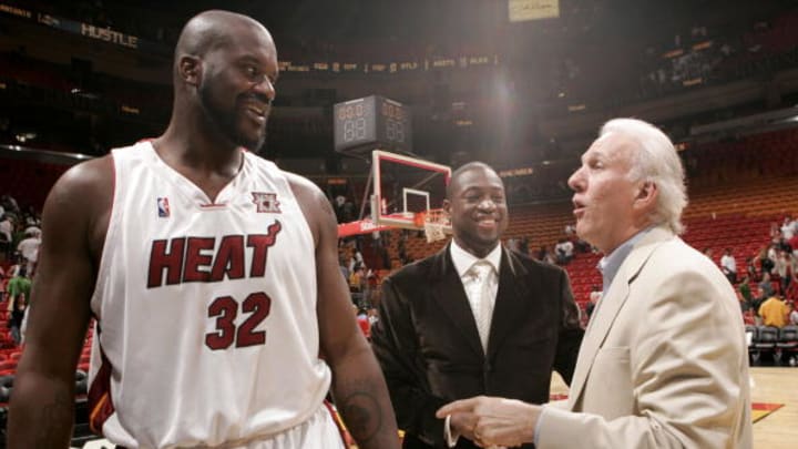 Shaquille O'Neal #32 and Dwyane Wade #3 of the Miami Heat talk to Head Coach of the San Antonio Spurs Gregg Popovich on October 23, 2007 at the American Airlines Arena in Miami, Florida.