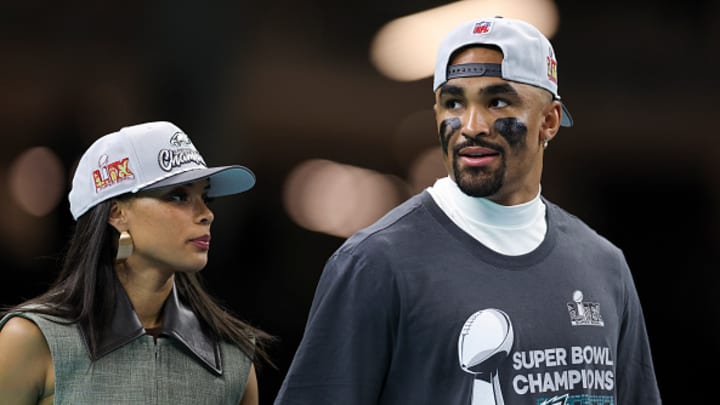Jalen Hurts #1 of the Philadelphia Eagles stands with fiancée Bry Burrows after winning Super Bowl LIX against the Kansas City Chiefs at Caesars Superdome on February 09, 2025, in New Orleans, Louisiana. The Eagles defeated the Chiefs 40-22. 