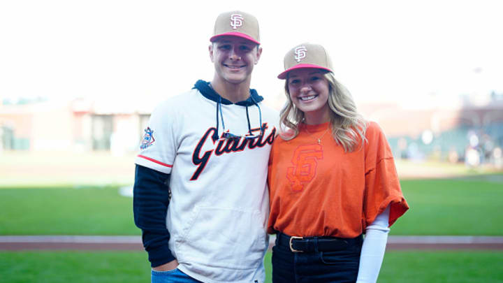 San Francisco 49ers quarterback Brock Purdy and wife Jenna Brandt pose for a photo at Oracle Park in San Francisco, California.