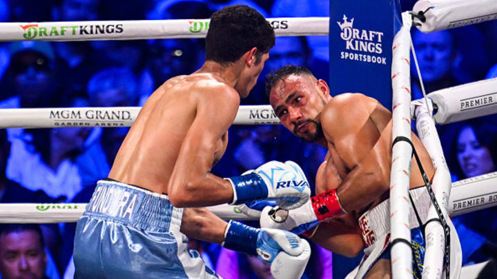 Keith Thurman (in white; blue short) and Sebastian Fundora (in turquoise and white short) exchange punches during their WBC world super welterweight champion titles. Keith Thurman (in white; blue short) and Sebastian Fundora (in turquoise and white short) exchange punches during their WBC world super welterweight champion titles.