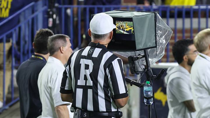 An official reviews a play where Michigan Wolverines quarterback Bryce Underwood (not pictured) threw a Hail Mary pass out the end zone with time expired during the fourth quarter. 