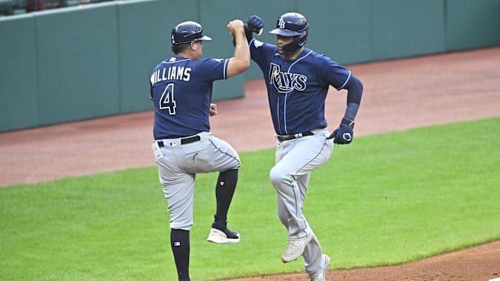Sep 2, 2023; Cleveland, Ohio, USA; Tampa Bay Rays catcher Christian Bethancourt (14) celebrates with third base coach Brady Williams (4) after hitting a three-run home run against the Cleveland Guardians in the fifth inning at Progressive Field. Mandatory Credit: David Richard-Imagn Images