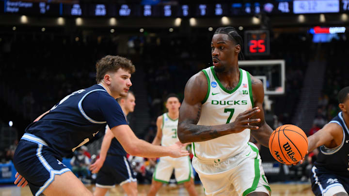Mar 21, 2025; Seattle, WA, USA; Oregon Ducks forward Supreme Cook (7) dribbles the ball against the Liberty Flames during the second half in the first round of the NCAA Tournament at Climate Pledge Arena. Mandatory Credit: Steven Bisig-Imagn Images