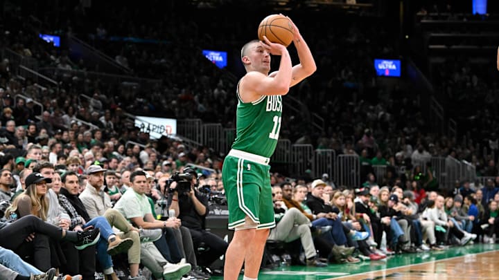 Dec 12, 2024; Boston, Massachusetts, USA;  Boston Celtics guard Payton Pritchard (11) shoots the ball against the Detroit Pistons during the second half at TD Garden. Mandatory Credit: Eric Canha-Imagn Images