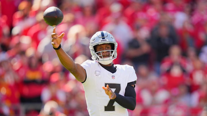 Oct 19, 2025; Kansas City, Missouri, USA; Las Vegas Raiders quarterback Geno Smith (7) passes the ball against the Kansas City Chiefs during the third quarter of the game at GEHA Field at Arrowhead Stadium. Mandatory Credit: Jay Biggerstaff-Imagn Images