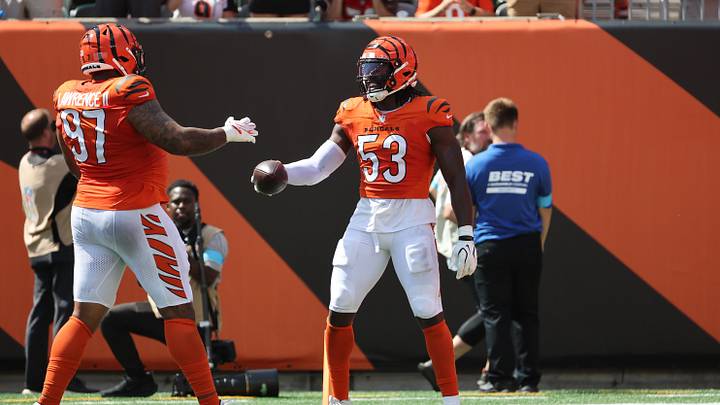 Sep 13, 2026; Cincinnati, Ohio, USA;  Cincinnati Bengals defensive end Boye Mafe (53) hands the ball to Cincinnati Bengals defensive tackle Dexter Lawrence II (97) during the first quarter at Paycor Stadium.  Mandatory Credit: Joseph Maiorana-Imagn Images