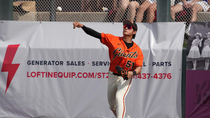 Feb 23, 2026; Scottsdale, Arizona, USA; San Francisco Giants center fielder Jung Hoo Lee (51) throws to the infield against the Athletics in the third inning at Scottsdale Stadium. Mandatory Credit: Rick Scuteri-Imagn Images