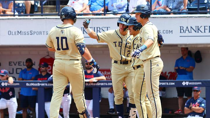 Jun 1, 2025; Oxford, MS, USA; Georgia Tech Yellowjackets firstbase Kent Schmidt (10) reacts with shortstop Kyle Lodise (2), outfielder Drew Burress (8), and second baseman Alex Hernandez (4), after a home run during the first inning against the Mississippi Rebels. Mandatory Credit: Petre Thomas-Imagn Images Jun 1, 2025; Oxford, MS, USA; Georgia Tech Yellowjackets firstbase Kent Schmidt (10) reacts with shortstop Kyle Lodise (2), outfielder Drew Burress (8), and second baseman Alex Hernandez (4), after a home run during the first inning against the Mississippi Rebels. Mandatory Credit: Petre Thomas-Imagn Images