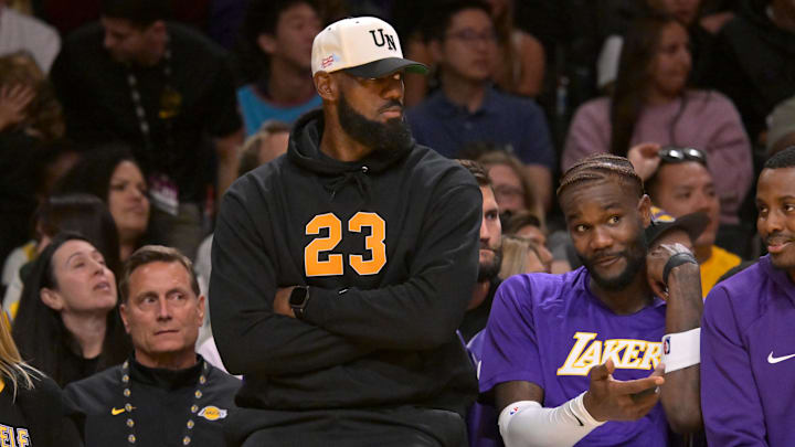 Oct 12, 2025; Los Angeles, CA;  Lebron James looks on from the bench during a preseason game against the Golden State Warriors