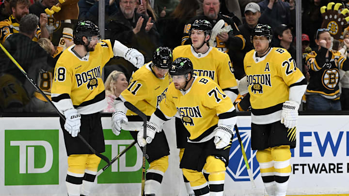 Mar 7, 2026; Boston, Massachusetts, USA; Boston Bruins left wing Viktor Arvidsson (71) celebrates with his teammates after coring a goal against the Washington Capitals during the third period at the TD Garden. Mandatory Credit: Brian Fluharty-Imagn Images