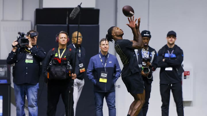 Apr 4, 2025; Boulder, CO, USA; Colorado Buffaloes wide receiver Travis Hunter (12) catches the ball at the University of Colorado NFL Showcase at the CU Indoor Practice Facility.  