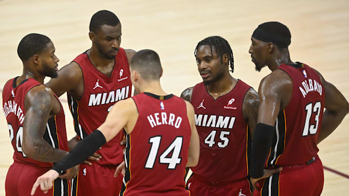 Apr 20, 2025; Cleveland, Ohio, USA; The Miami Heat gather in front of the bench during a timeout in the fourth quarter against the Cleveland Cavaliers at Rocket Arena. Mandatory Credit: David Richard-Imagn Images