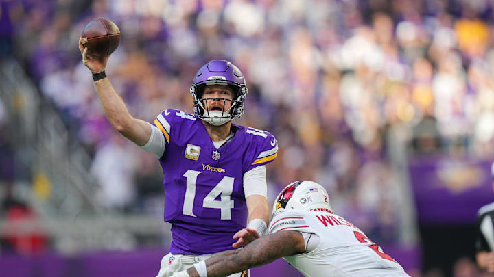 Dec 1, 2024; Minneapolis, Minnesota, USA; Minnesota Vikings quarterback Sam Darnold (14) passes against the Arizona Cardinals in the third quarter at U.S. Bank Stadium. Mandatory Credit: Brad Rempel-Imagn Images