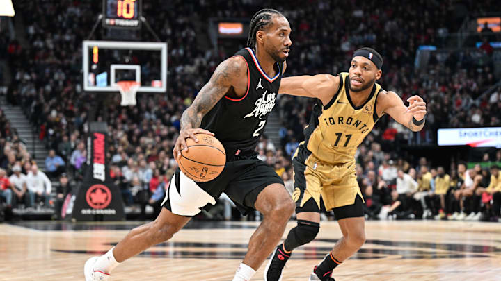 Jan 26, 2024; Toronto, Ontario, CAN;   Los Angeles Clippers forward Kawhi Leonard (2) dribble the ball past Toronto Raptors guard Bruce Brown (11) in the second half at Scotiabank Arena. Mandatory Credit: Dan Hamilton-Imagn Images