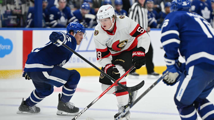 Sep 22, 2024; Toronto, Ontario, CAN; Ottawa Senators forward Carter Yakemchuk (58) skates past Toronto Maple Leafs defenseman Jake McCabe (22) as he moves in to score the winning goal in overtime at Scotiabank Arena. Mandatory Credit: Dan Hamilton-Imagn Images Sep 22, 2024; Toronto, Ontario, CAN; Ottawa Senators forward Carter Yakemchuk (58) skates past Toronto Maple Leafs defenseman Jake McCabe (22) as he moves in to score the winning goal in overtime at Scotiabank Arena. Mandatory Credit: Dan Hamilton-Imagn Images