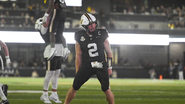 Nov 8, 2025; Nashville, Tennessee, USA;  Vanderbilt Commodores quarterback Diego Pavia (2) celebrates the touchdown of wide receiver Tre Richardson (6) against the Auburn Tigers during the second half at FirstBank Stadium. Mandatory Credit: Steve Roberts-Imagn Images