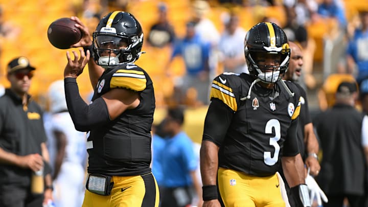 Sep 22, 2024; Pittsburgh, Pennsylvania, USA; Pittsburgh Steelers quarterback Justin Fields (2) warms up next to quarterback Russell Wilson (3) before a game against the Los Angeles Chargers at Acrisure Stadium. Mandatory Credit: Barry Reeger-Imagn Images