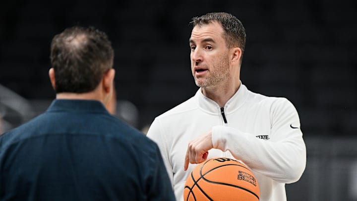 Mar 21, 2024; Indianapolis, IN, USA; Utah State Aggies head coach Danny Sprinkle is seen during the NCAA tournament practice day at Gainbridge FieldHouse. Mandatory Credit: Robert Goddin-Imagn Images