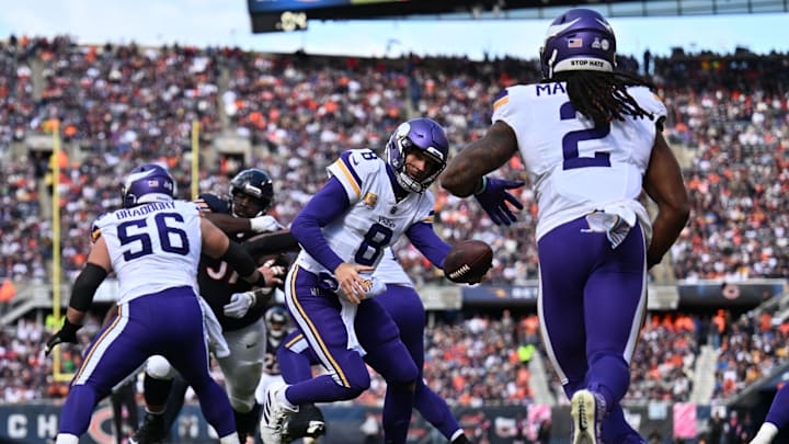Oct 15, 2023; Chicago, Illinois, USA;  Minnesota Vikings quarterback Kirk Cousins (8) hands off to