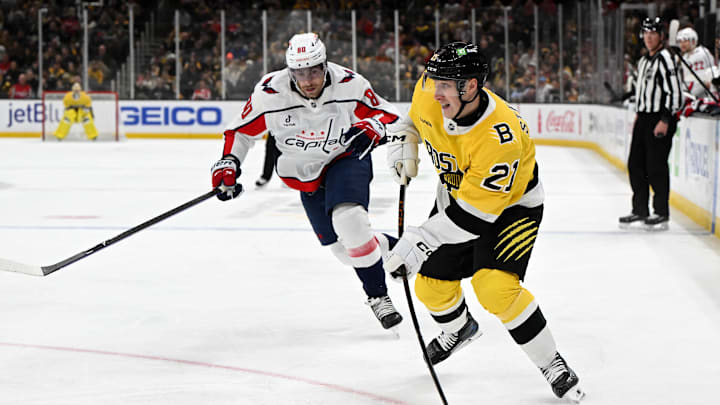 Mar 7, 2026; Boston, Massachusetts, USA; Boston Bruins center Alex Steeves (21) attempts a shot against the Washington Capitals during the third period at the TD Garden. Mandatory Credit: Brian Fluharty-Imagn Images