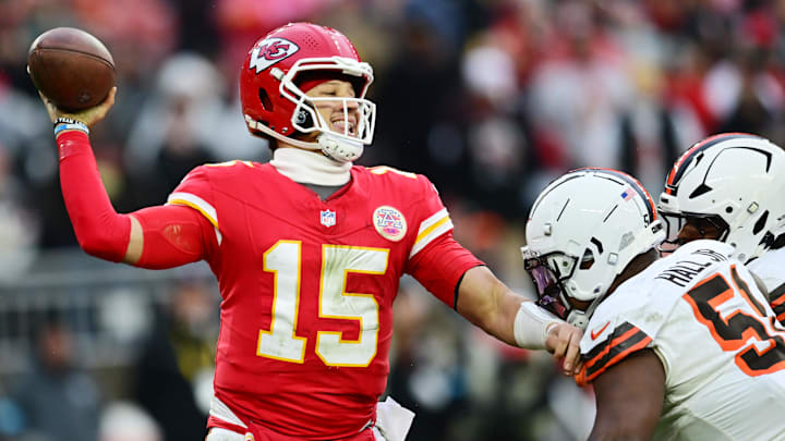 Dec 15, 2024; Cleveland, Ohio, USA; Cleveland Browns defensive tackle Mike Hall Jr. (51) and linebacker Devin Bush (30) rush Kansas City Chiefs quarterback Patrick Mahomes (15) during the second half at Huntington Bank Field. Mandatory Credit: Ken Blaze-Imagn Images