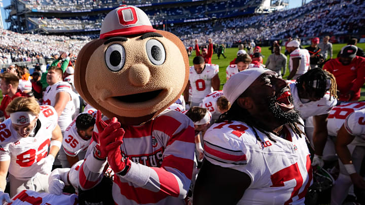 Ohio State Buckeyes offensive lineman Donovan Jackson (74) and mascot Brutus celebrate following the NCAA football game against the Penn State Nittany Lions at Beaver Stadium in University Park, Pa. on Monday, Nov. 4, 2024. Ohio State won 20-13.