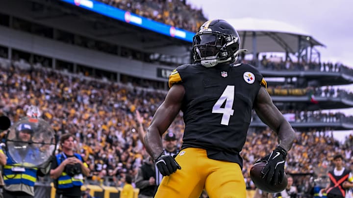 Oct 12, 2025; Pittsburgh, Pennsylvania, USA; Pittsburgh Steelers wide receiver DK Metcalf (4) makes a catch for a touchdown during the fourth quarter at Acrisure Stadium. 