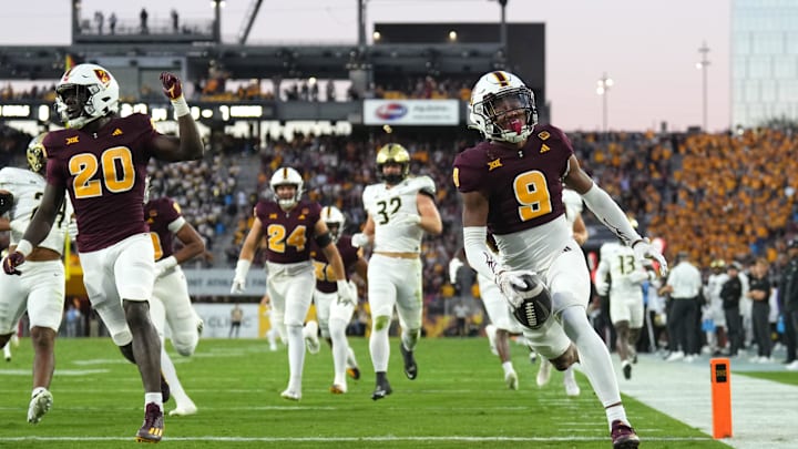 Nov 9, 2024; Tempe, Arizona, USA; Arizona State Sun Devils defensive back Montana Warren (9) returns a blocked punt for a touchdown against the UCF Knights during the first half at Mountain America Stadium, Home of the ASU Sun Devils. Mandatory Credit: Joe Camporeale-Imagn Images