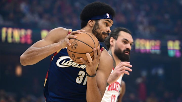 Nov 19, 2025; Cleveland, Ohio, USA; Cleveland Cavaliers center Jarrett Allen (31) rebounds against Houston Rockets center Steven Adams (12) during the first half at Rocket Arena. Mandatory Credit: David Dermer-Imagn Images