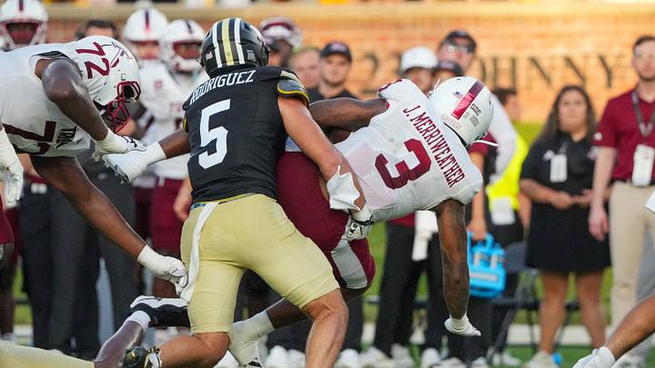 Sep 19, 2026; Columbia, Missouri, USA; Troy Trojans running back Jaheim Merriweather (3) runs the ball as Missouri Tigers linebacker Nicholas Rodriguez (5) attempts the tackle during the first half of the game at Faurot Field at Memorial Stadium. Mandatory Credit: Denny Medley-Imagn Images Sep 19, 2026; Columbia, Missouri, USA; Troy Trojans running back Jaheim Merriweather (3) runs the ball as Missouri Tigers linebacker Nicholas Rodriguez (5) attempts the tackle during the first half of the game at Faurot Field at Memorial Stadium. Mandatory Credit: Denny Medley-Imagn Images