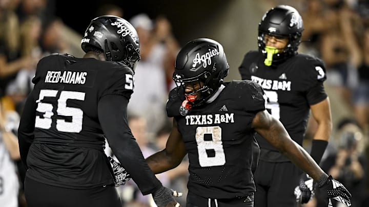 Oct 26, 2024; College Station, Texas, USA; Texas A&M Aggies running back Le'Veon Moss (8) reacts after scoring a touchdown against the LSU Tigers in the fourth quarter at Kyle Field. Mandatory Credit: Maria Lysaker-Imagn Images. 