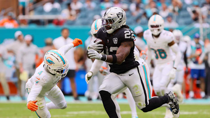 Las Vegas Raiders running back Alexander Mattison (22) runs with the football against Miami Dolphins cornerback Kader Kohou (4) during the fourth quarter at Hard Rock Stadium last season. Las Vegas Raiders running back Alexander Mattison (22) runs with the football against Miami Dolphins cornerback Kader Kohou (4) during the fourth quarter at Hard Rock Stadium last season.