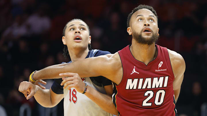 Mar 3, 2025; Miami, Florida, USA; Miami Heat forward Kyle Anderson (20) and Washington Wizards forward Kyshawn George (18) wait for a rebound during the second half at Kaseya Center. Mandatory Credit: Rhona Wise-Imagn Images