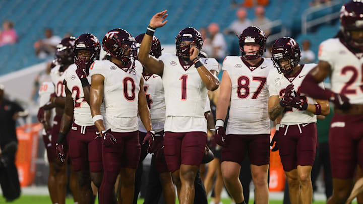 Sep 27, 2024; Miami Gardens, Florida, USA; Virginia Tech Hokies quarterback Kyron Drones (1) reacts on the field before the game against the Miami Hurricanes at Hard Rock Stadium. Mandatory Credit: Sam Navarro-Imagn Images Sep 27, 2024; Miami Gardens, Florida, USA; Virginia Tech Hokies quarterback Kyron Drones (1) reacts on the field before the game against the Miami Hurricanes at Hard Rock Stadium. Mandatory Credit: Sam Navarro-Imagn Images