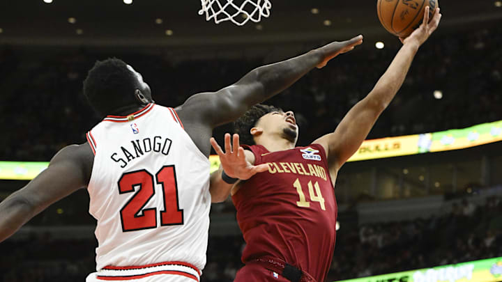 Oct 18, 2024; Chicago, Illinois, USA;  Cleveland Cavaliers guard Jules Bernard (14) shoots against Chicago Bulls center Adama Sanogo (21) during the second half at the United Center. Mandatory Credit: Matt Marton-Imagn Images