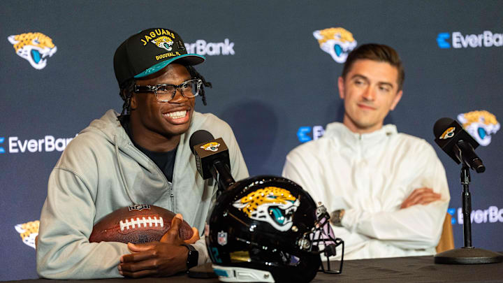 The Jacksonville Jaguars’ first-round pick, Colorado Buffaloes wide receiver and defensive back Travis Hunter, left, answers questions as General Manager James Gladstone, right, sits next to him during a press conference Friday, March 25, 2025 at Miller Electric Center in Jacksonville, Fla.