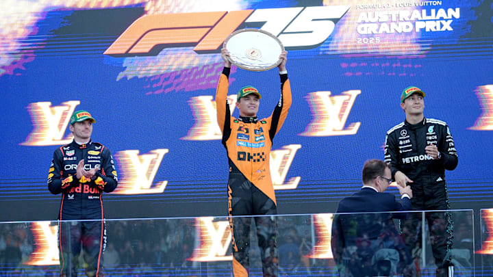 [US, Mexico & Canada customers only] March 16, 2025; Melbourne, AUSTRALIA; Lando Norris celebrates next to Max Verstappen and George Russell after winning the F1 Australian Grand Prix at Albert Park Grand Prix Circuit. Mandatory Credit: Tracey Nearmy/Reuters via Imagn Images