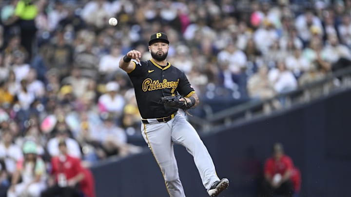 May 30, 2025; San Diego, California, USA; Pittsburgh Pirates shortstop Isiah Kiner-Falefa (7) throws out San Diego Padres right fielder Fernando Tatis Jr. (23) at first base during the fourth inning at Petco Park. Mandatory Credit: Denis Poroy-Imagn Images
