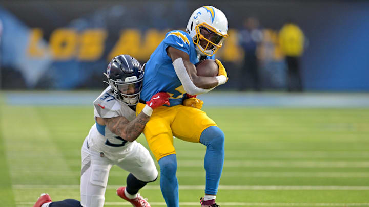 Nov 10, 2024; Inglewood, California, USA;  Tennessee Titans safety Amani Hooker (37) takes down Los Angeles Chargers wide receiver Joshua Palmer (5) after a first down in the second half at SoFi Stadium. 