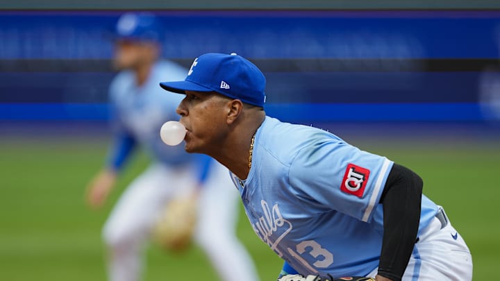 Mar 30, 2025; Kansas City, Missouri, USA; Kansas City Royals first baseman Salvador Perez (13) blows a bubble while defending during the fifth inning against the Cleveland Guardians at Kauffman Stadium. Mandatory Credit: Jay Biggerstaff-Imagn Images