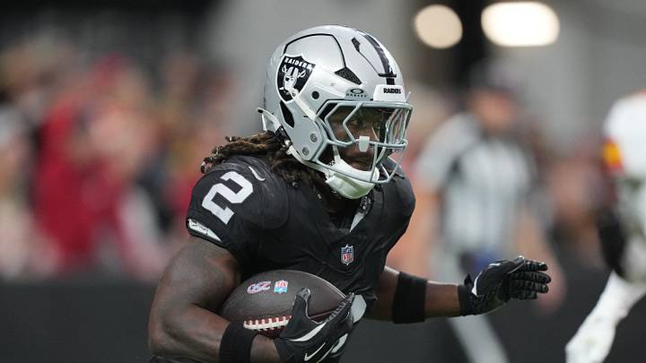 Jan 4, 2026; Paradise, Nevada, USA; Las Vegas Raiders running back Ashton Jeanty (2) carries the ball against the Kansas City Chiefs in the first half at Allegiant Stadium. Mandatory Credit: Kirby Lee-Imagn Images