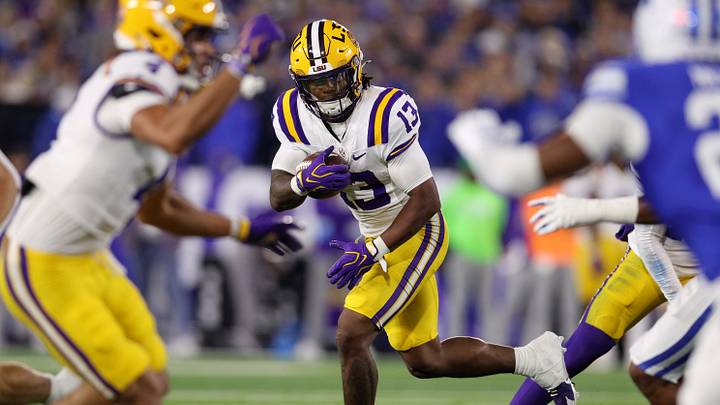 Oct 10, 2026; Lexington, Kentucky, USA; LSU Tigers running back Dilin Jones (13) runs the ball against the Kentucky Wildcats during the first quarter at Kroger Field. Mandatory Credit: Jordan Prather-Imagn Images Oct 10, 2026; Lexington, Kentucky, USA; LSU Tigers running back Dilin Jones (13) runs the ball against the Kentucky Wildcats during the first quarter at Kroger Field. Mandatory Credit: Jordan Prather-Imagn Images